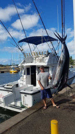 My Husband with 2 of his 4 marlin caught off H