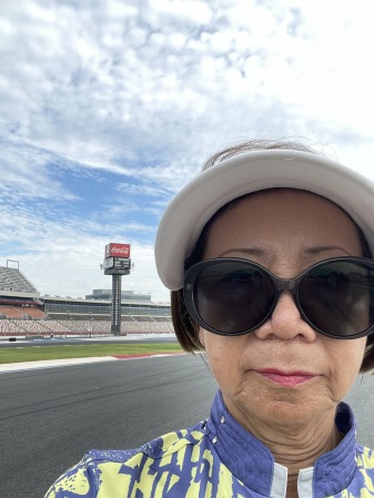 Sandy standing on the Charlotte Motor Speedway