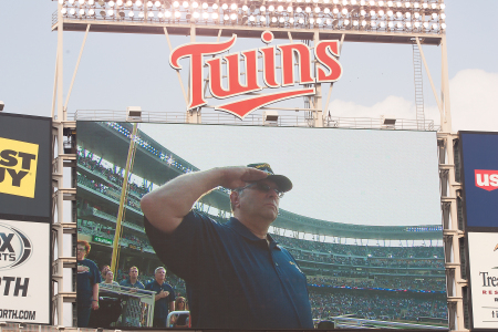 honorary flag raiser at Twins baseball game